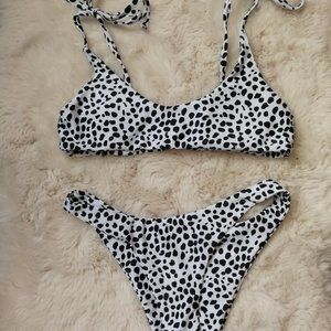 White swimsuit set with black pattern, no padding. No tags.